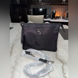 Prada wristlet (slightly damaged ) READ DESCRIPTION
